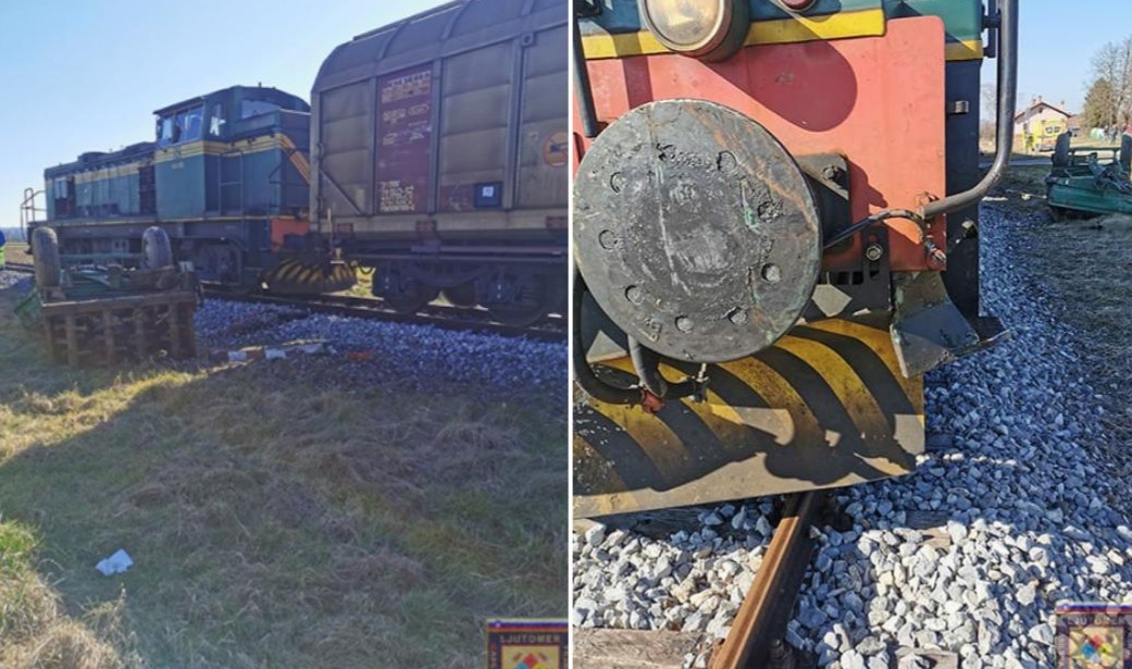 FOTO: Na prehodu čez železnico trčila vlak in traktor, ena oseba utrpela poškodbe